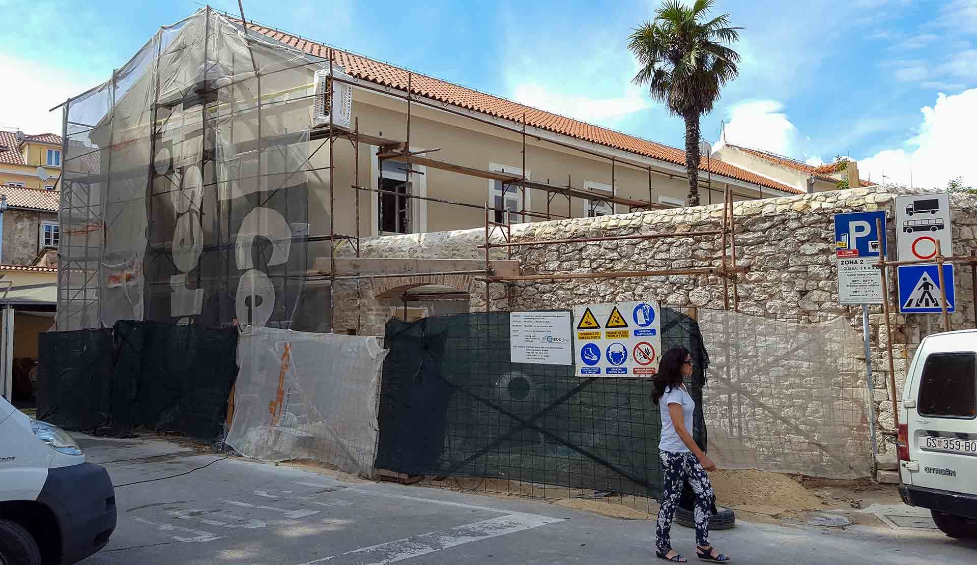 A view of the freshly painted facade of the future Almayer Hotel during its 2016 reconstruction.