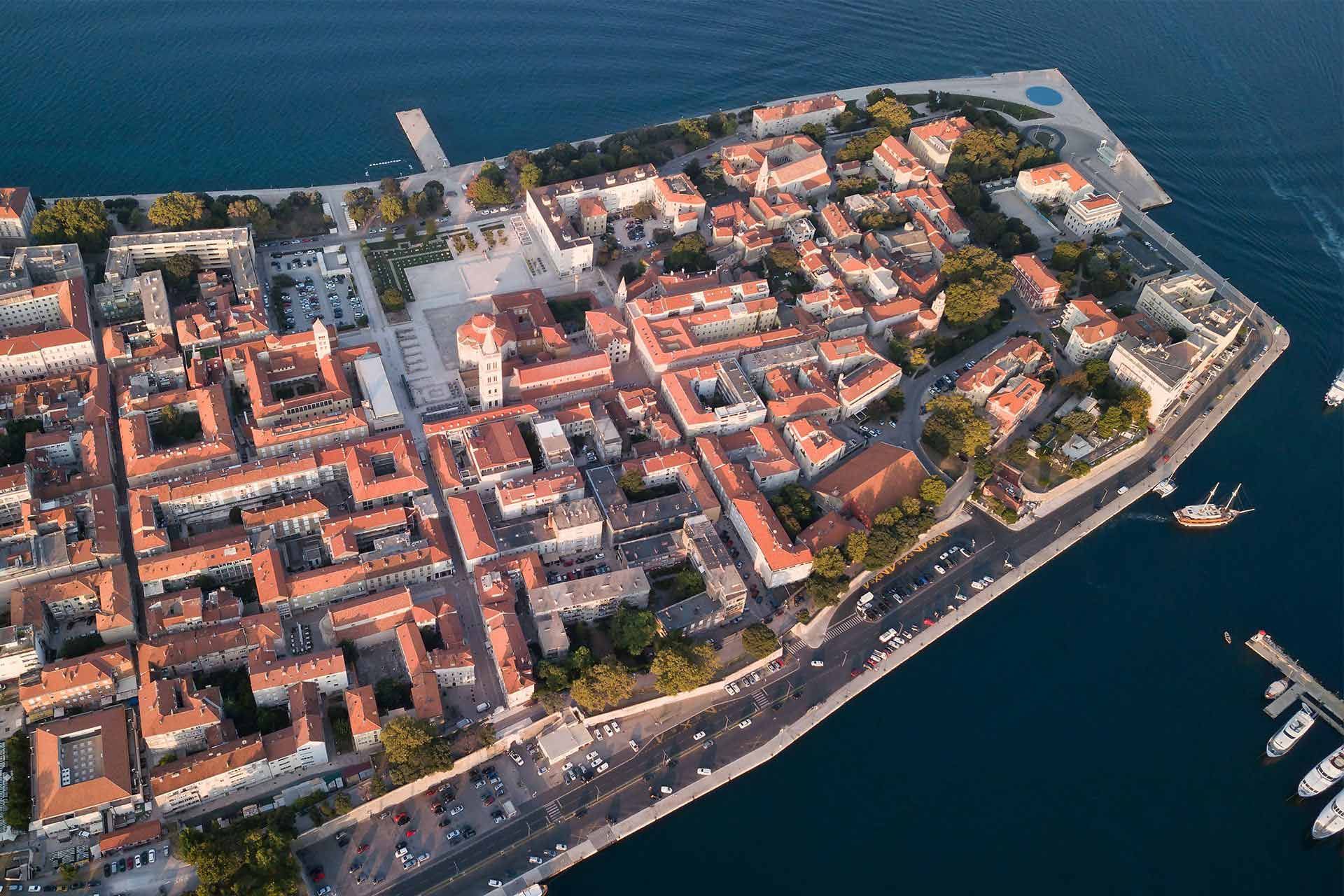 A breathtaking aerial view of Zadar's historic core, stunning architecture, and vibrant atmosphere, including the Almayer Art & Heritage Hotel. Book now for the Extended Stay Rate special offer!