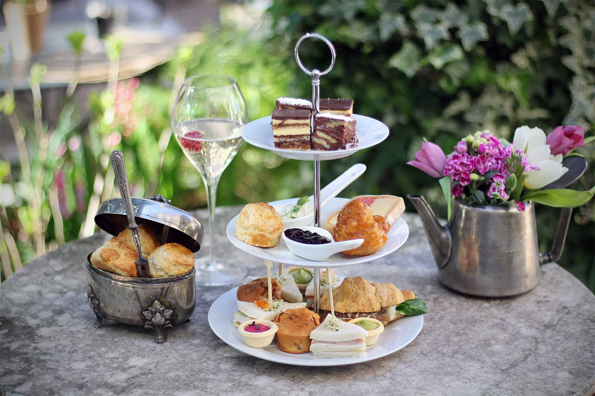 Enjoy luxurious teatime at Almayer Art & Heritage Hotel's Corte Restaurant secret garden with our Extended Stay Rate special offer.