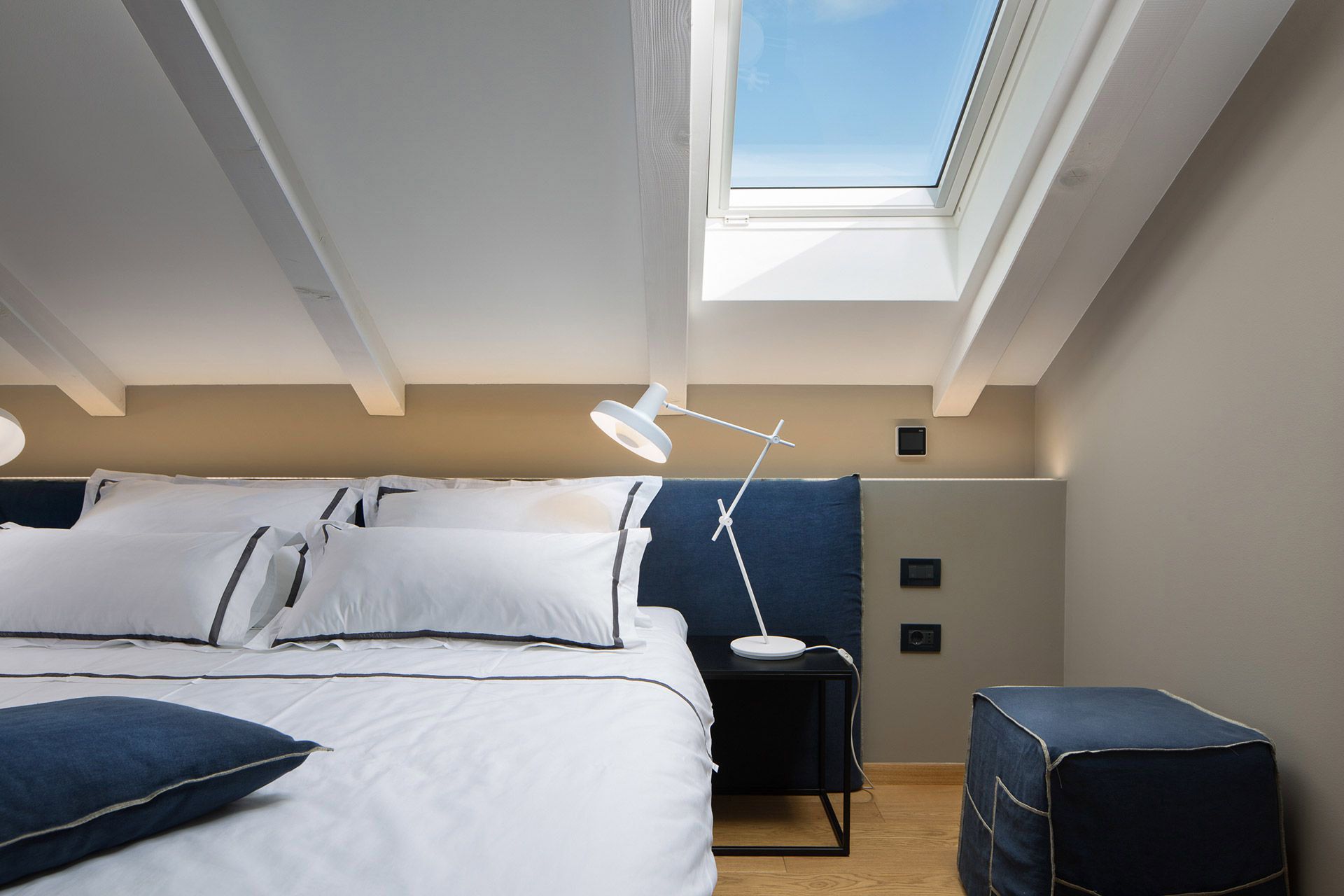 Cushy sleeping area with a comfortable king-size bed in Almayer hotel’s deluxe mezzanine double room