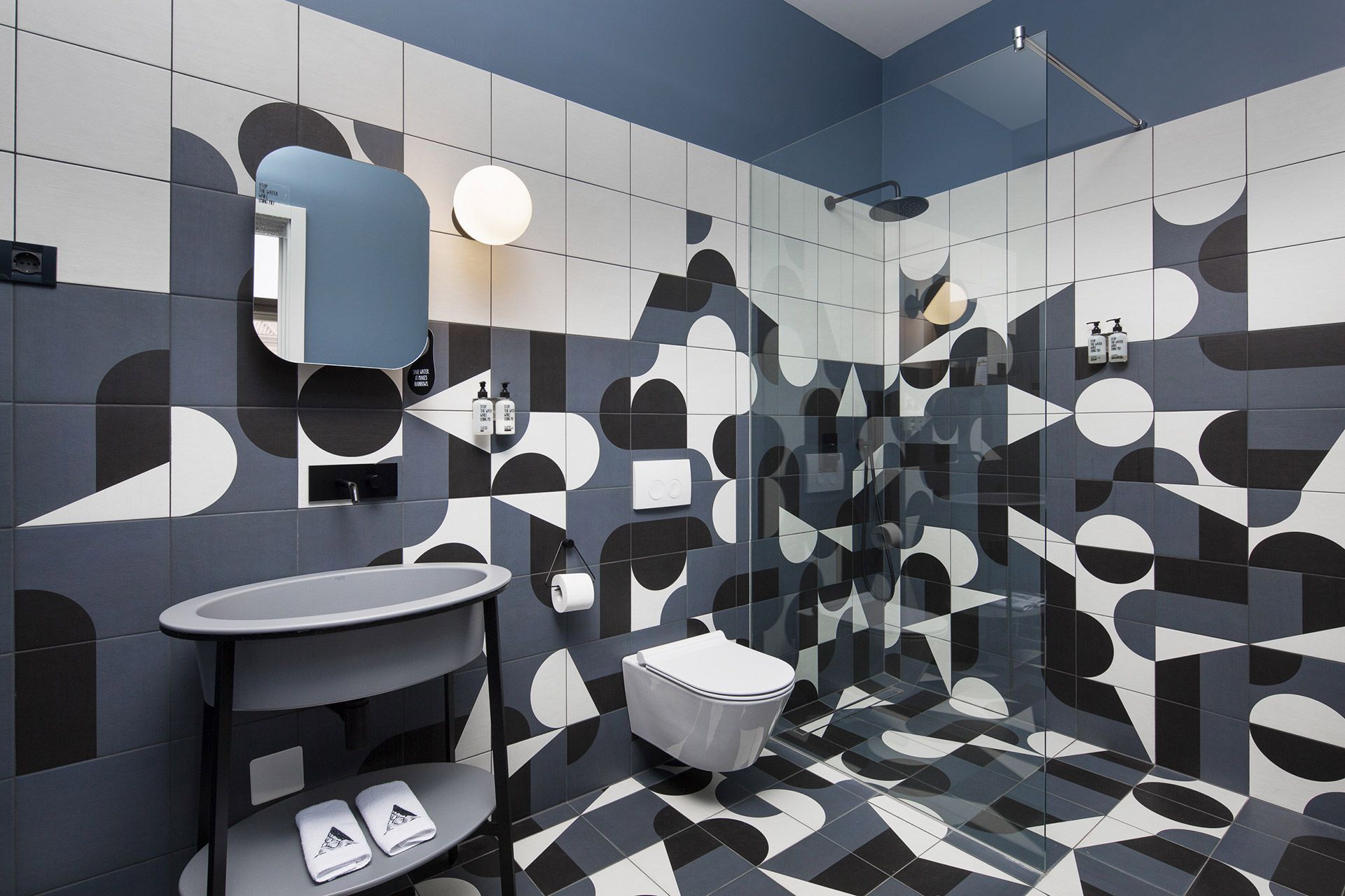 Designer ceramic tiles in the bathroom of a deluxe double room in the Almayer Hotel’s dependance