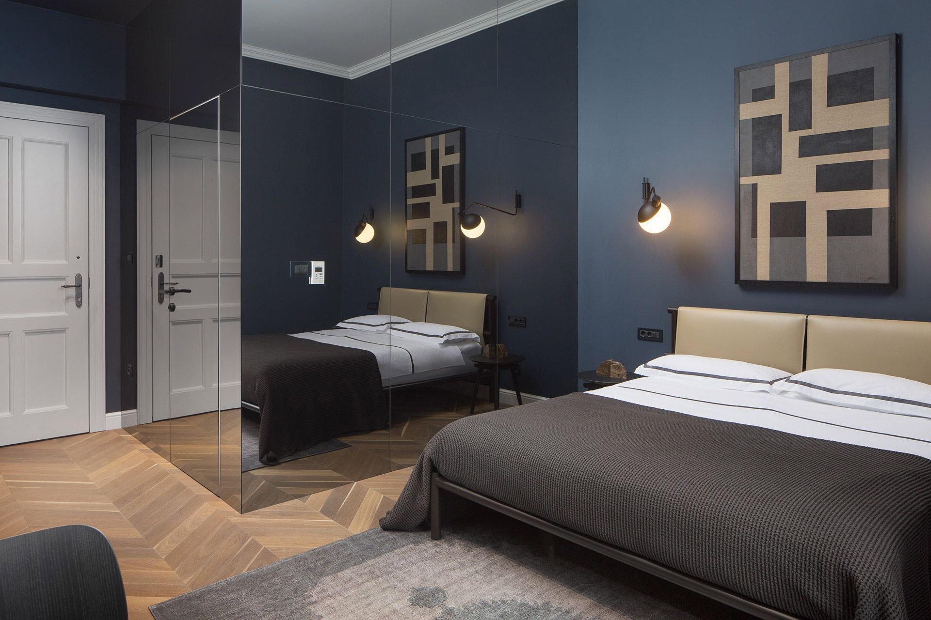 Almayer Dependance Superior double room “Burato” - interior with queen size bed and artwork reflected in mirrored wall